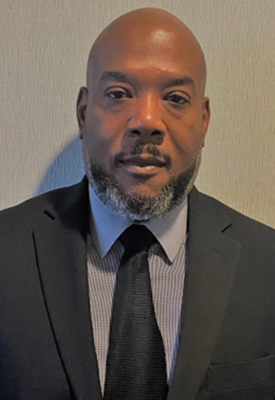 Travis Kelly_headshot 275 Travis Kelly_headshot 275